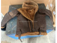 WWII WWII RAF Irvin sheepskin flying jacket with a very unusual hood and an original size label.